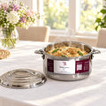 Boîte repas isotherme inox TACSAM 1,5 L ouverte avec un plat, couvercle posé à côté
