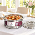 Boîte repas isotherme inox TACSAM 8,5 L ouverte avec un plat, couvercle posé à côté